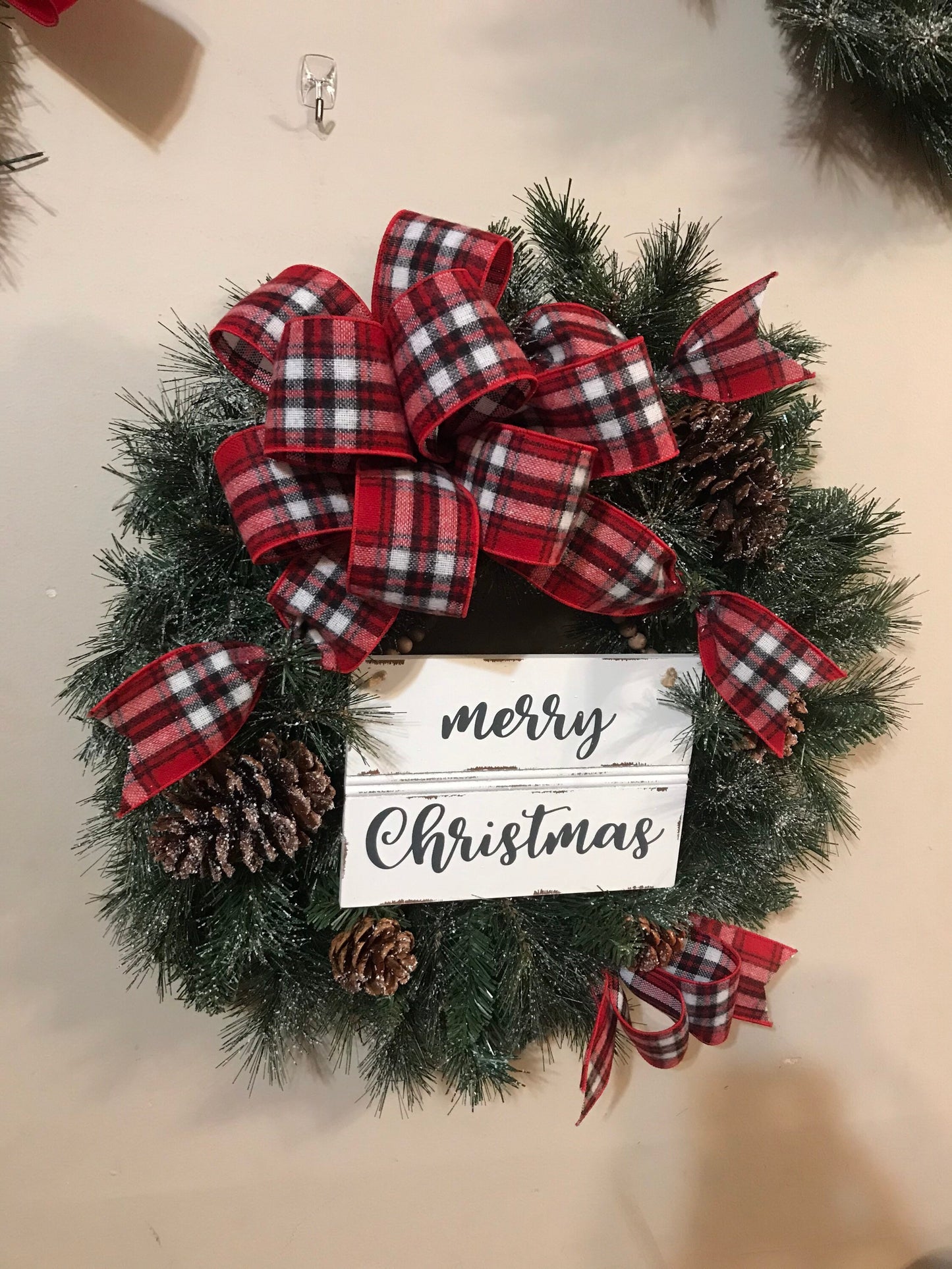 24” Frosted Evergreen Christmas Wreath with plaid bow and Merry Christmas wooden sign