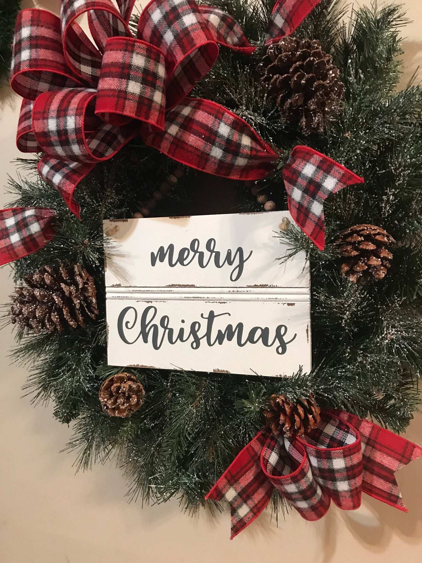 24” Frosted Evergreen Christmas Wreath with plaid bow and Merry Christmas wooden sign