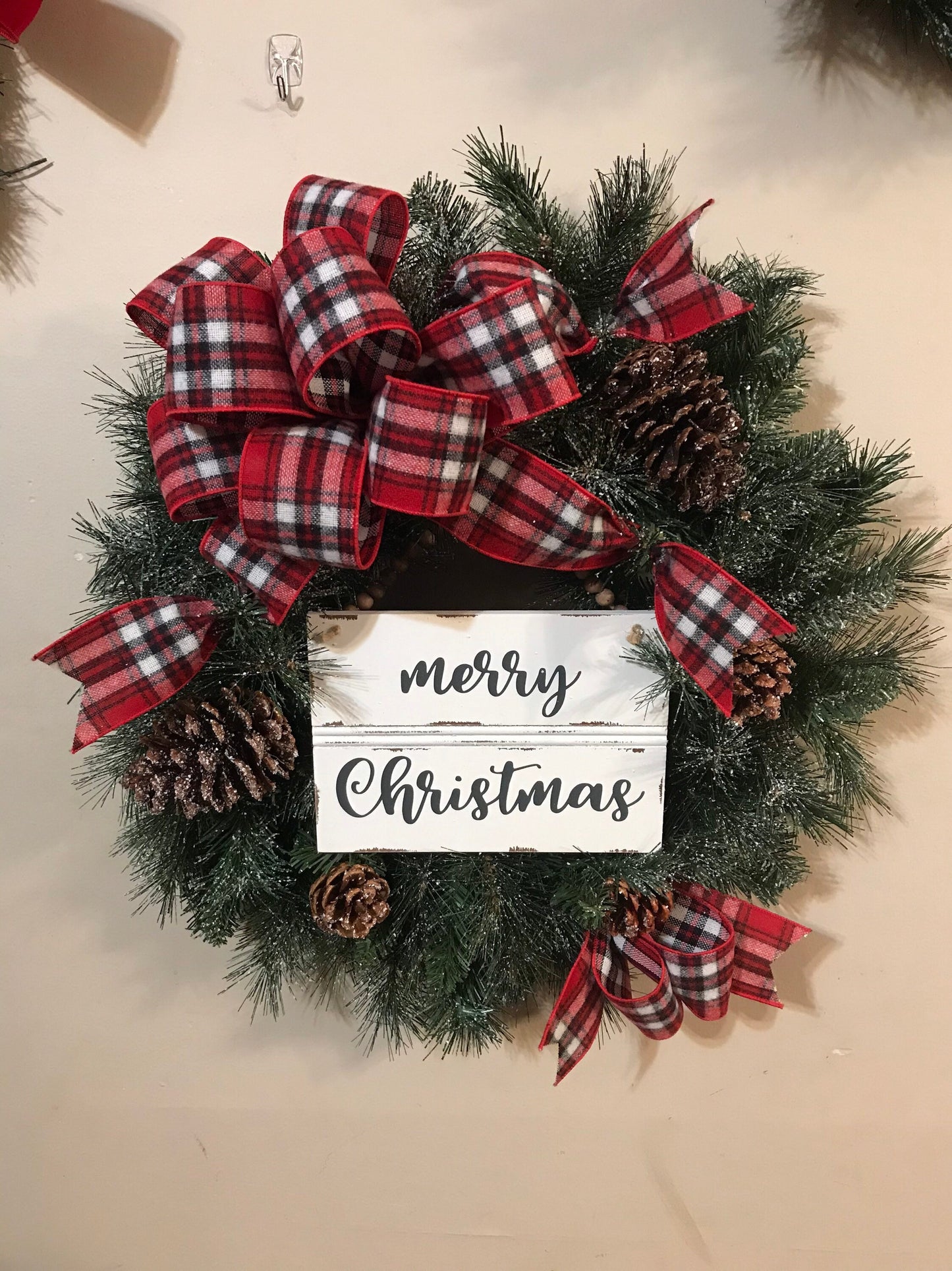 24” Frosted Evergreen Christmas Wreath with plaid bow and Merry Christmas wooden sign