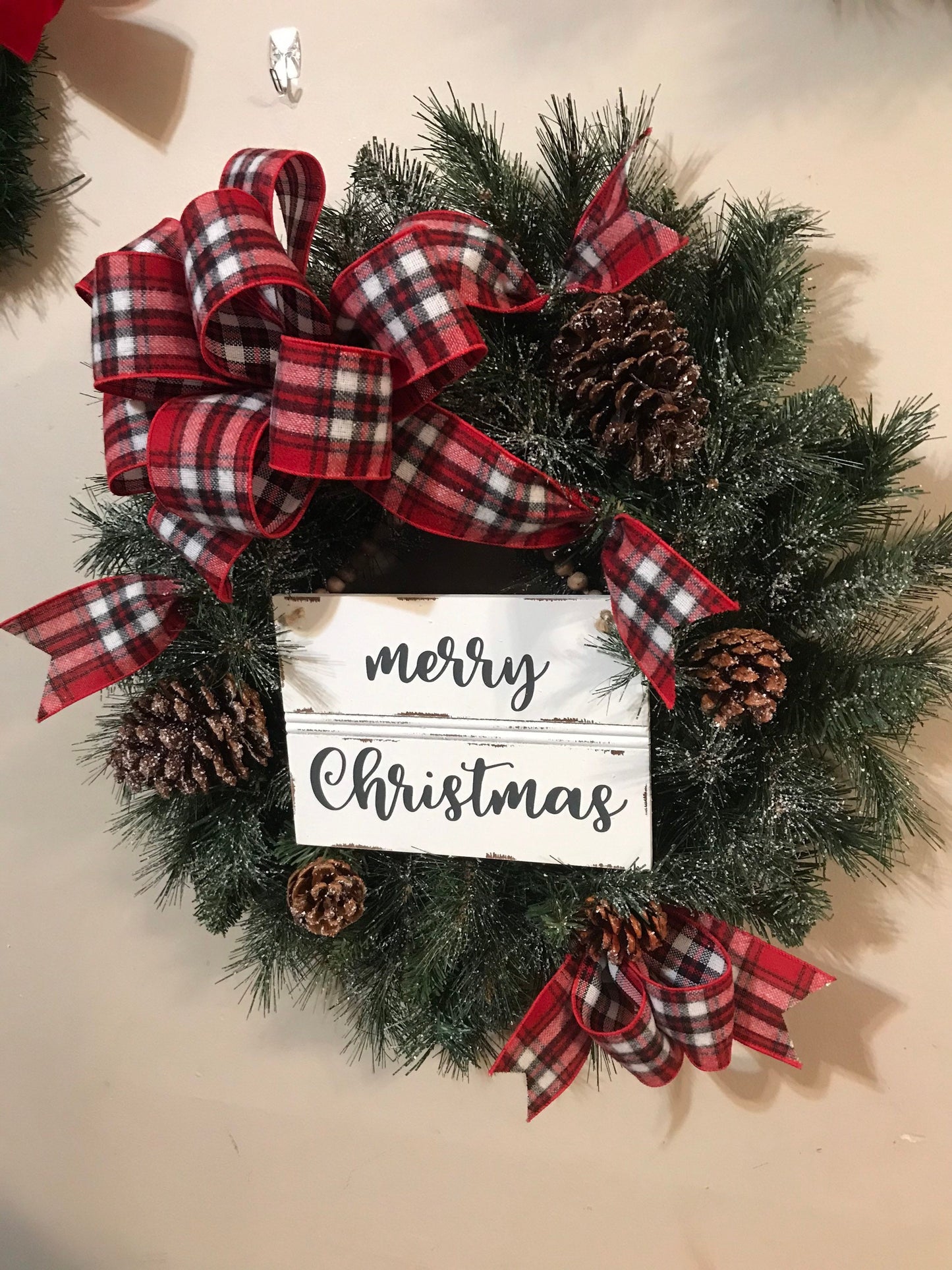 24” Frosted Evergreen Christmas Wreath with plaid bow and Merry Christmas wooden sign